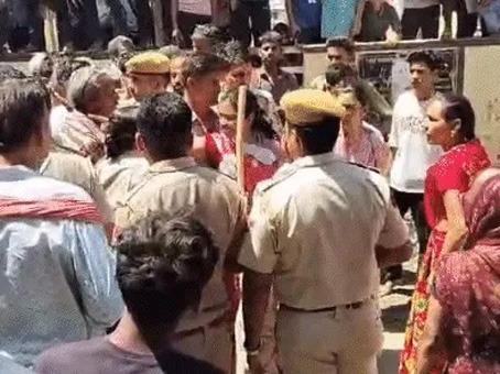 protest-placing-dead-body-ambulance-compensation