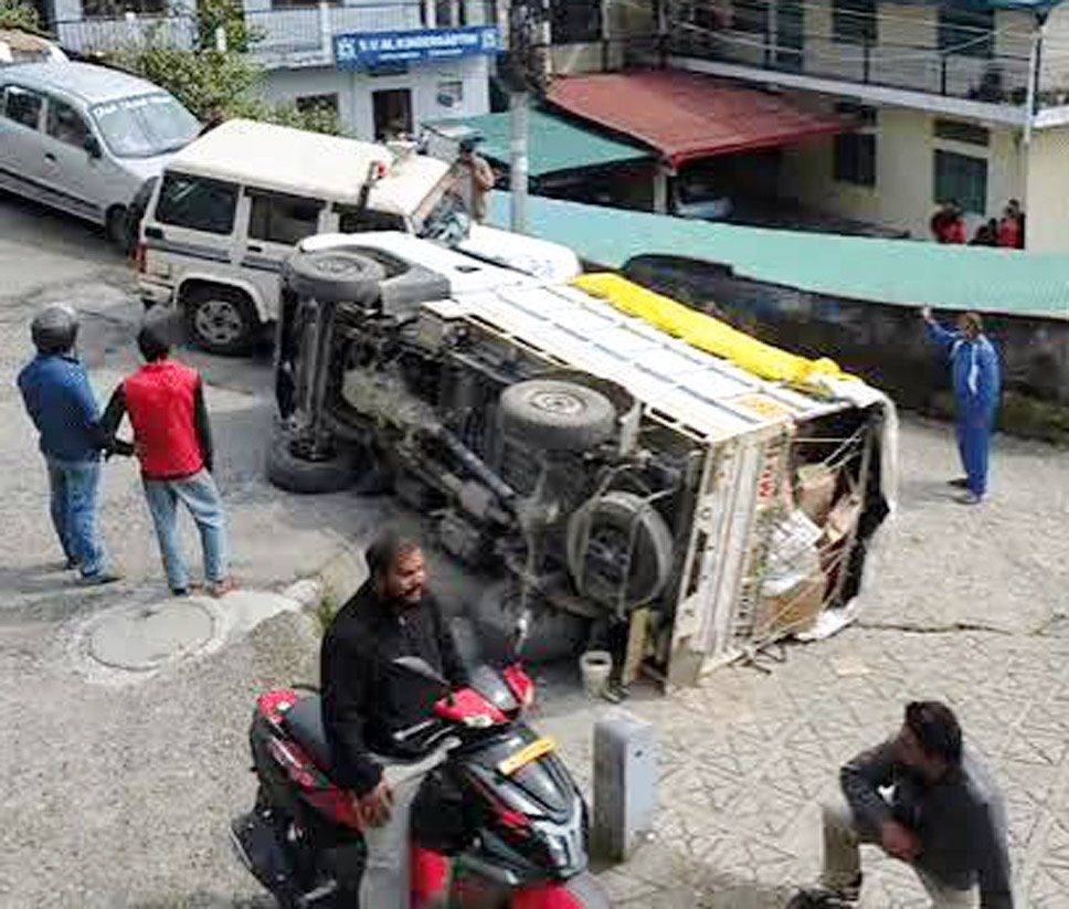 pickup-truck-overturns-near